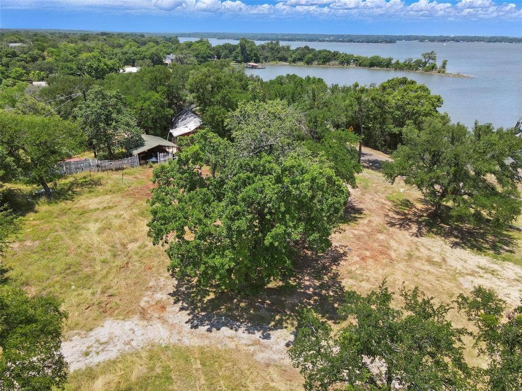 8505 Heron Drive, Fort Worth, TX 76108 Drone / aerial view of a nearby body of water and a forest