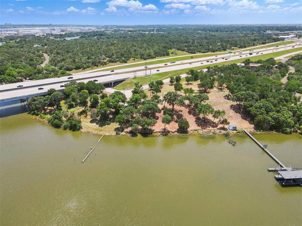 8505 Heron Drive, Fort Worth, TX 76108 Bird's eye view of a major roadway, a large body of water, and a tree filled landscape