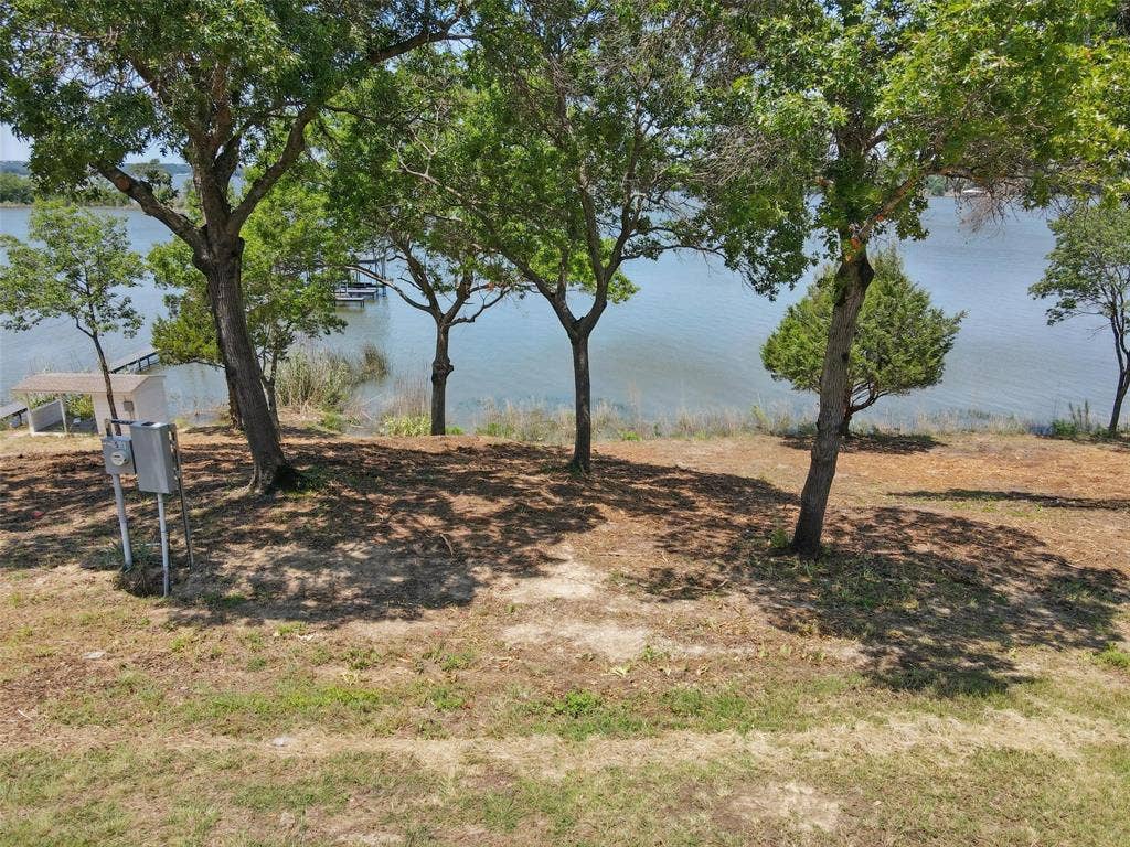 8501 A Heron Drive, Fort Worth, TX 76108 View of yard with a water view