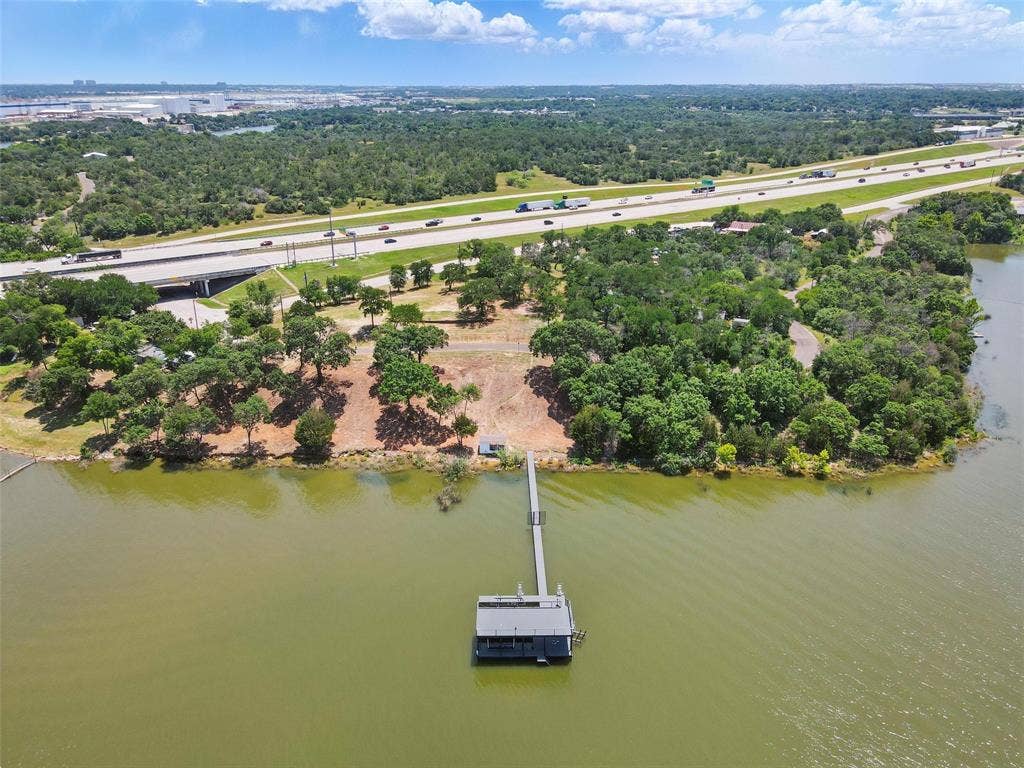 8501 A Heron Drive, Fort Worth, TX 76108 Aerial view of a highway, a large body of water, and a tree filled landscape