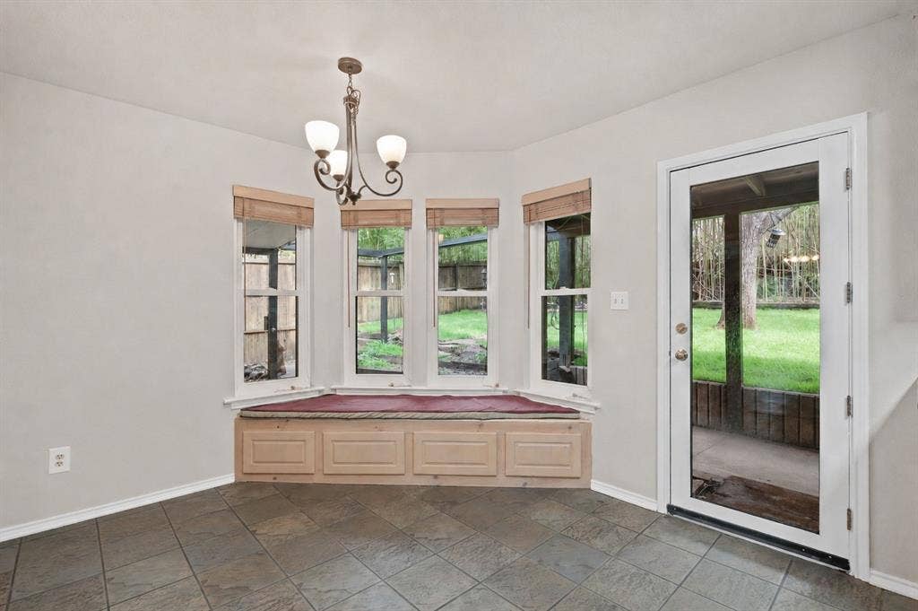 Breakfast nook in the eat in kitchen with access to the covered patio