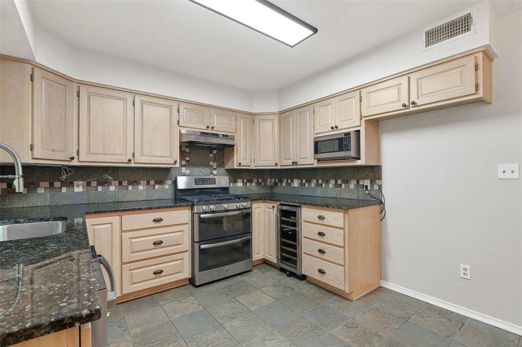 Kitchen with beverage fridge