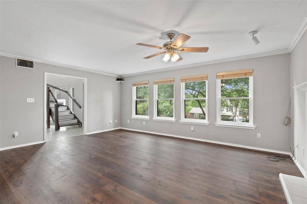 Living room with lots of natural light and brand new Pella windows!