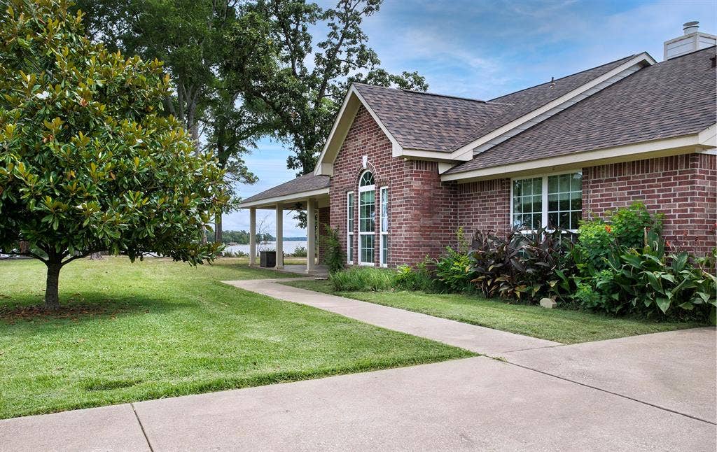 21750 Lakewood Lane, Chandler, TX 75758 Ground shot with lake in the background