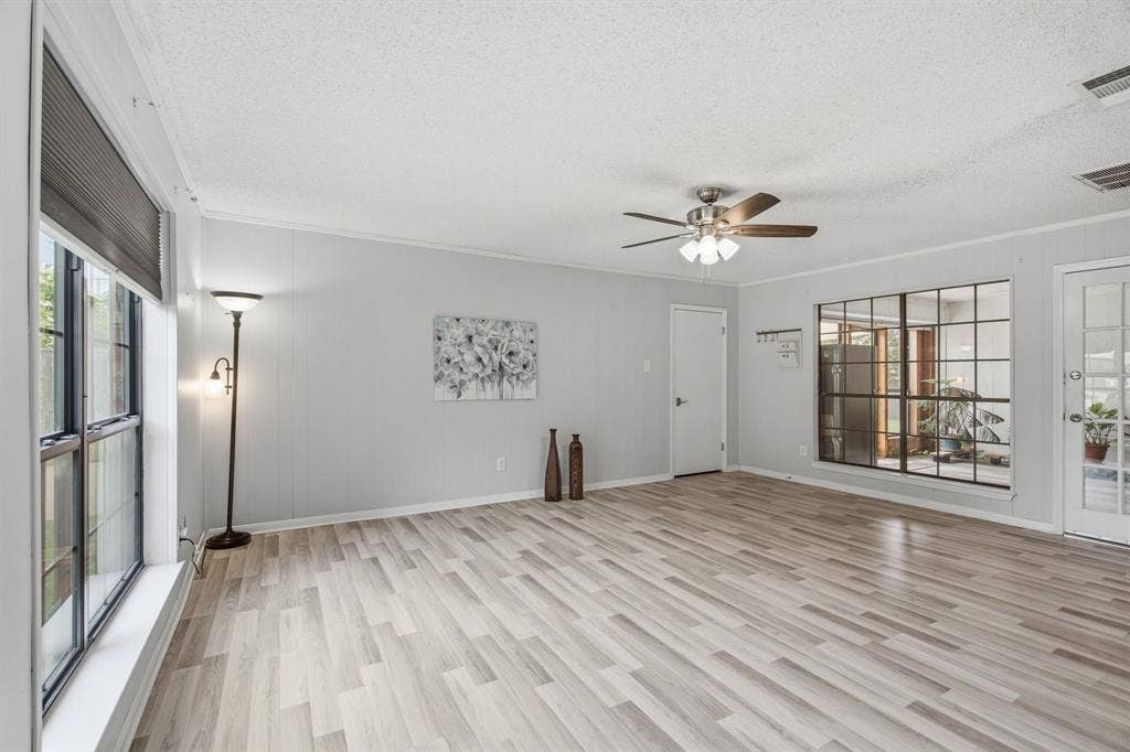 521 W Louella Drive, Hurst, TX 76054 Second living area or "dance floor" looking into the enclosed sunroom.