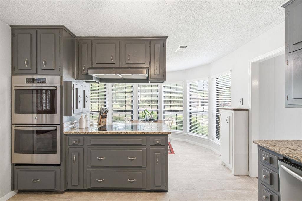 521 W Louella Drive, Hurst, TX 76054 Look at all those windows in the eat in kitchen!! Lots of natural light.