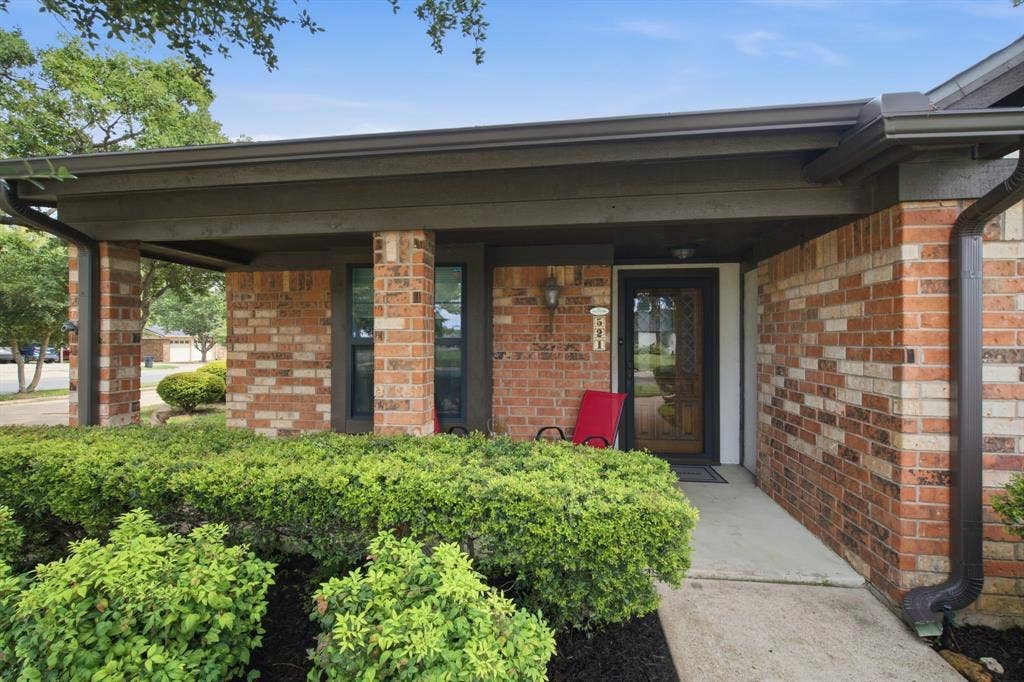 521 W Louella Drive, Hurst, TX 76054 Covered porch with room for seating, Glass storm door allows additional lighting yet locks for security.