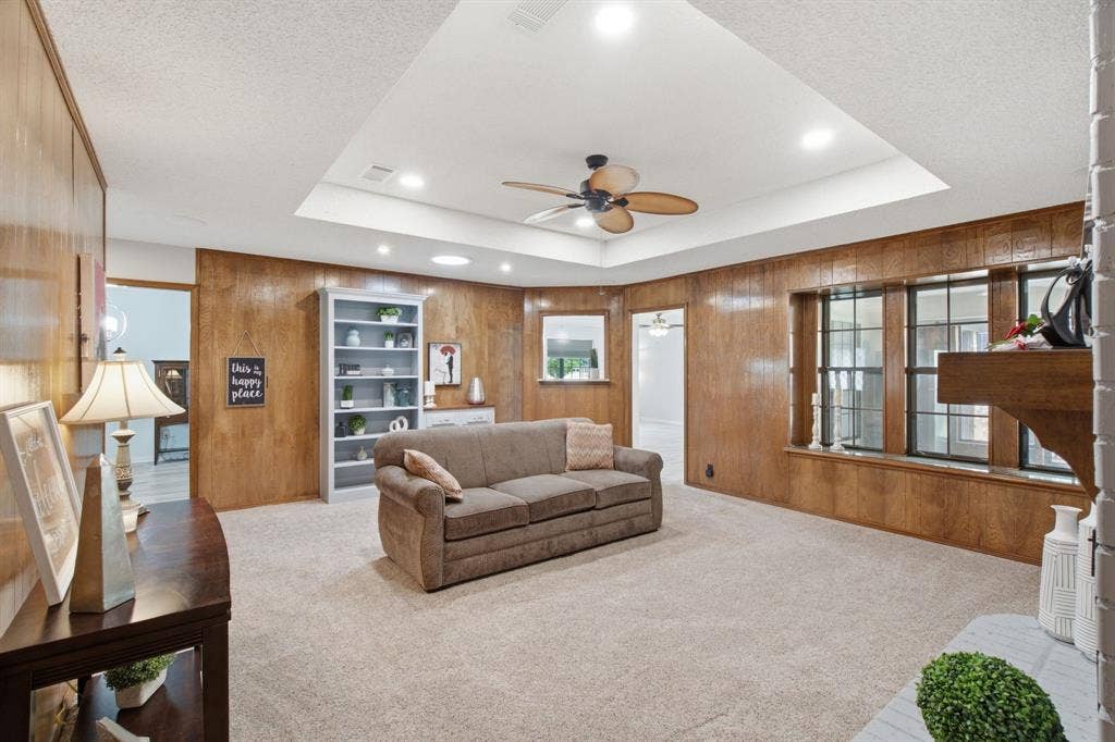 521 W Louella Drive, Hurst, TX 76054 Lovely wood paneling can be left as is or painted. Three windows with the window seat overlook the enclosed sunroom.