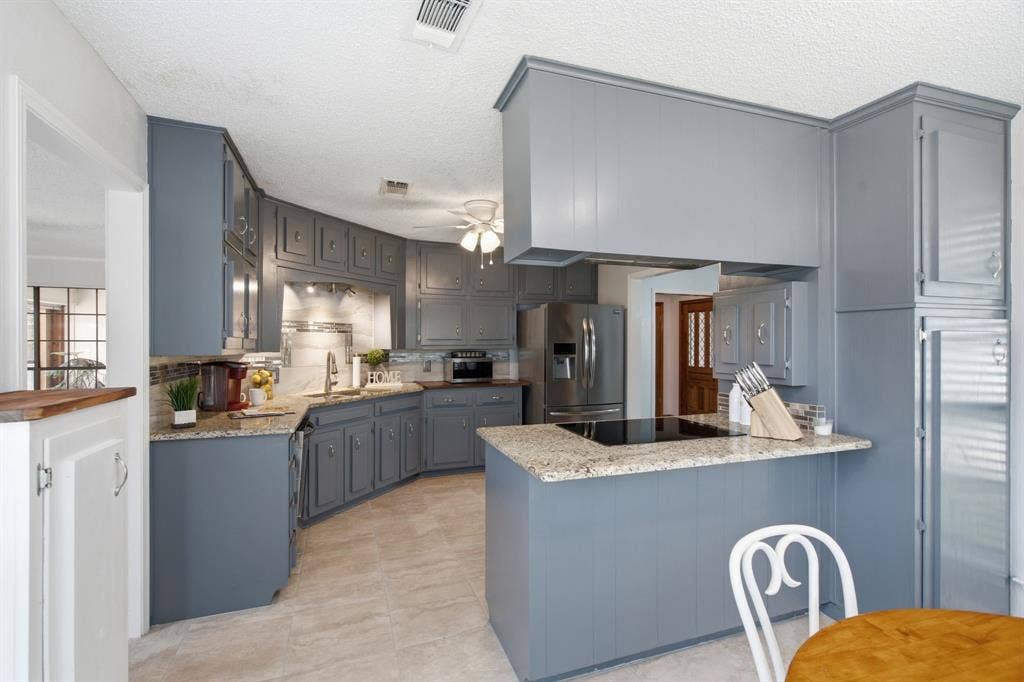 521 W Louella Drive, Hurst, TX 76054 View from the eat in kitchen shows the extra pantry on the right side.