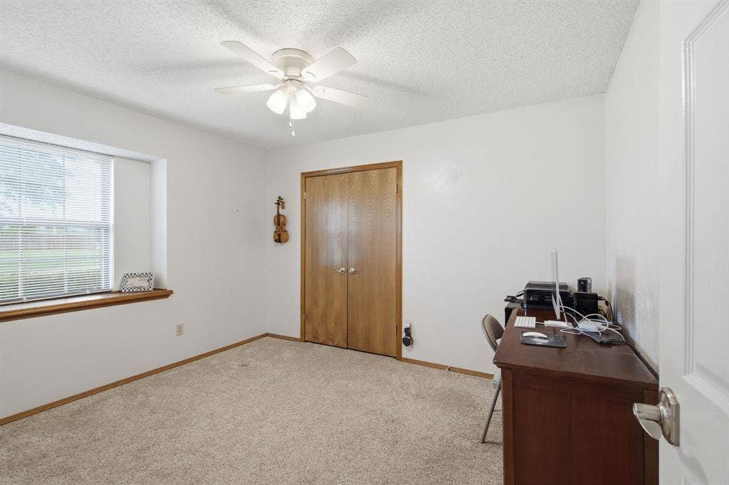 521 W Louella Drive, Hurst, TX 76054 Secondary bedroom with a window seat and walk in closet is perfect for an office.