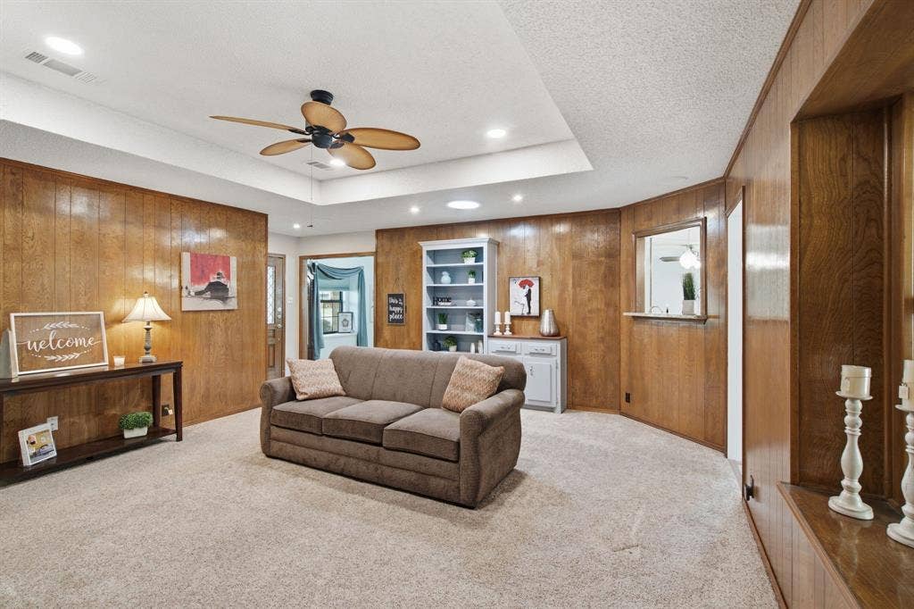 521 W Louella Drive, Hurst, TX 76054 Living room leads into the dining room, has a pass through to the wet bar and second living area. Love the window seats in multiple rooms.