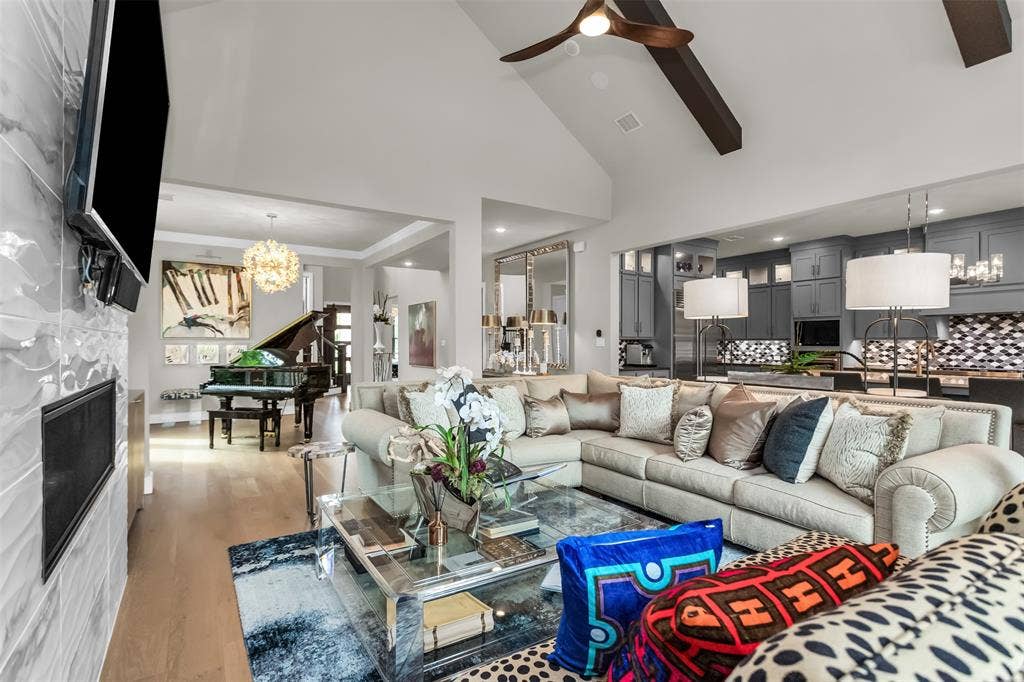 8138 Edgefield Court, Frisco, TX 75035 Vaulted ceiling with exposed wood beams and a ceiling fan