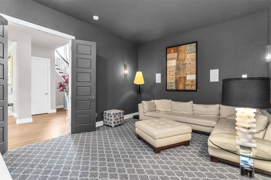 8138 Edgefield Court, Frisco, TX 75035 Room with dark gray walls and patterned carpet flooring