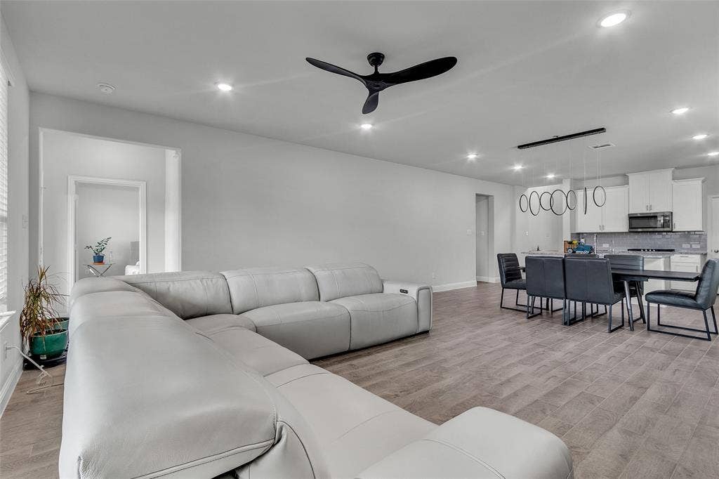 3708 Jan Camille Court, Celina, TX 75009 Living room featuring ceiling fan and light wood-type flooring