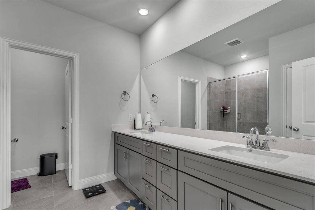 3708 Jan Camille Court, Celina, TX 75009 Bathroom featuring tile patterned flooring, an enclosed shower, and vanity