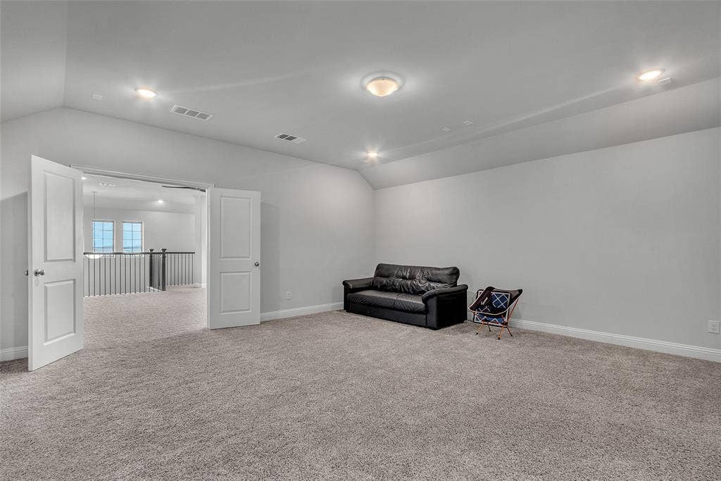 3708 Jan Camille Court, Celina, TX 75009 Living area featuring lofted ceiling and light colored carpet
