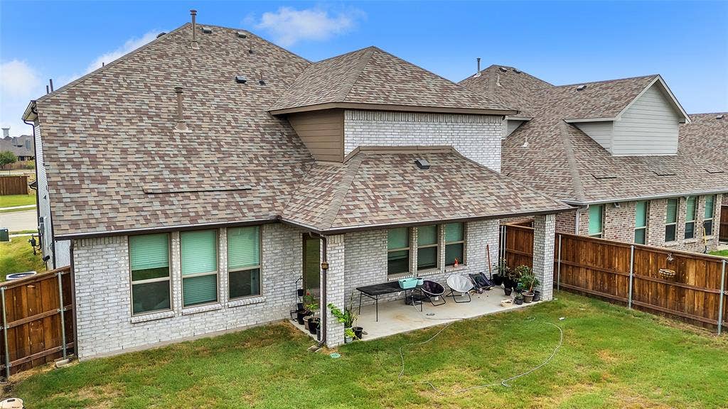 3708 Jan Camille Court, Celina, TX 75009 Back of house featuring a yard and a patio area
