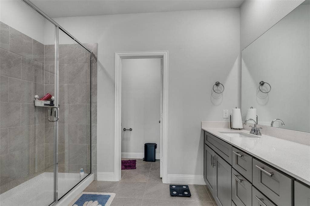 3708 Jan Camille Court, Celina, TX 75009 Bathroom featuring vanity, an enclosed shower, and tile patterned flooring