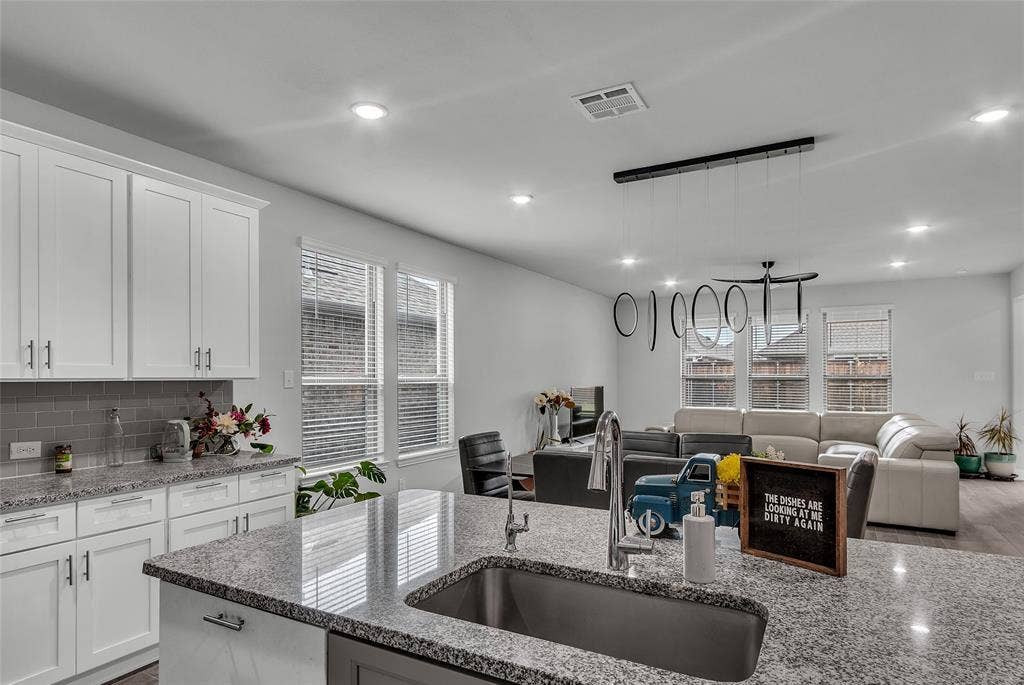3708 Jan Camille Court, Celina, TX 75009 Kitchen featuring plenty of natural light, white cabinetry, and sink