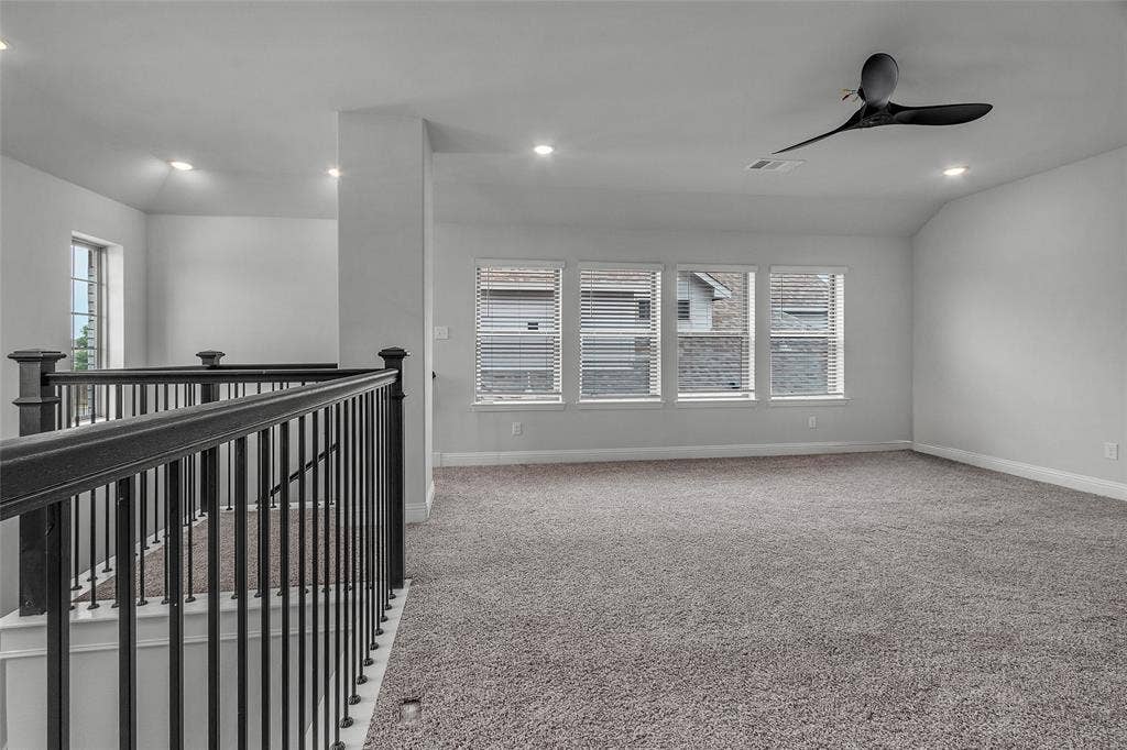 3708 Jan Camille Court, Celina, TX 75009 Hallway with vaulted ceiling and carpet flooring