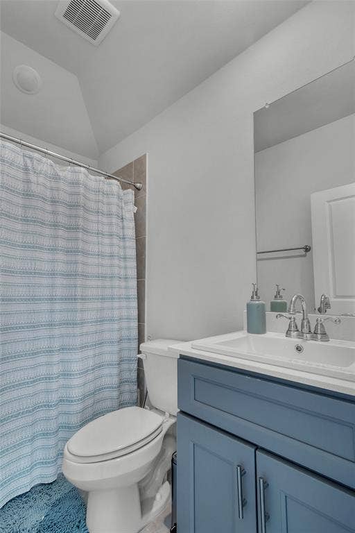 3708 Jan Camille Court, Celina, TX 75009 Bathroom featuring vanity, toilet, curtained shower, and vaulted ceiling