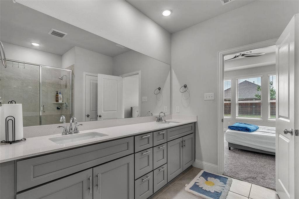 3708 Jan Camille Court, Celina, TX 75009 Bathroom with vanity, ceiling fan, tile patterned floors, and walk in shower