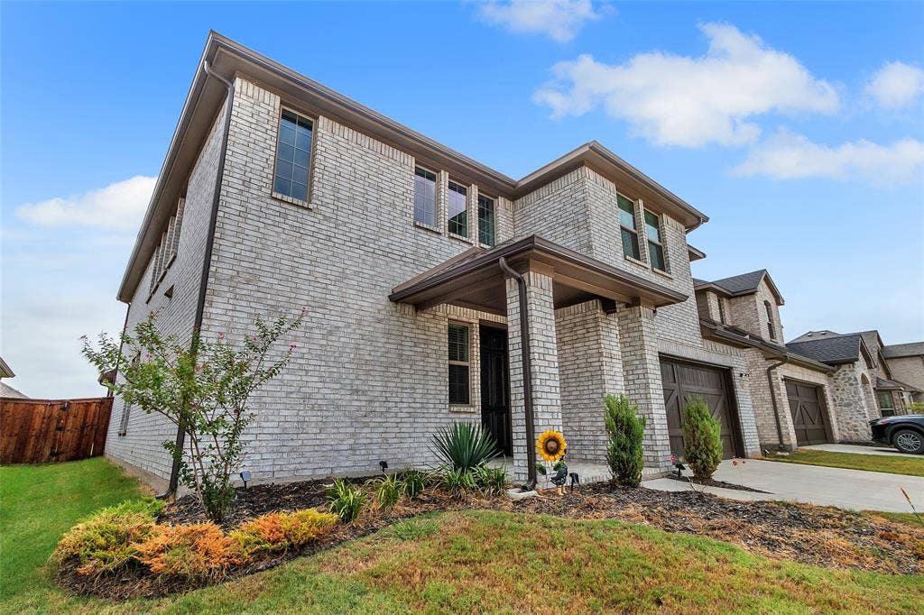 3708 Jan Camille Court, Celina, TX 75009 View of front of house with a front yard and a garage