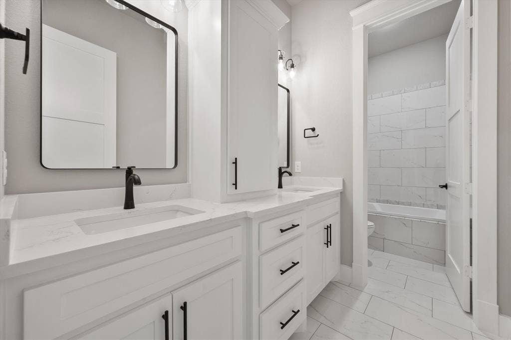 6610 Waggoner Way, Midlothian, TX 76065 Dual vanity with integrated sinks and white countertops