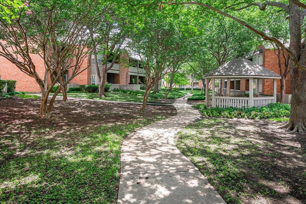 12680 Hillcrest Road, #1109, Dallas, TX 75230 Well manicured lush grounds make a beautiful place for a daily walk.