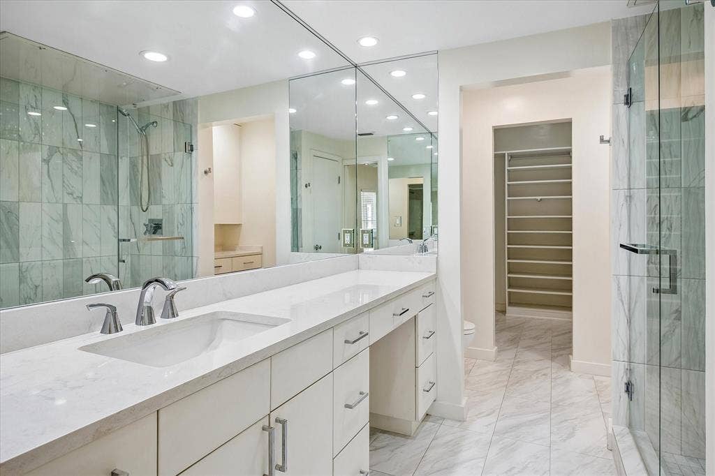 12680 Hillcrest Road, #1109, Dallas, TX 75230 Updated ensuite primary bathroom with a vanity area.