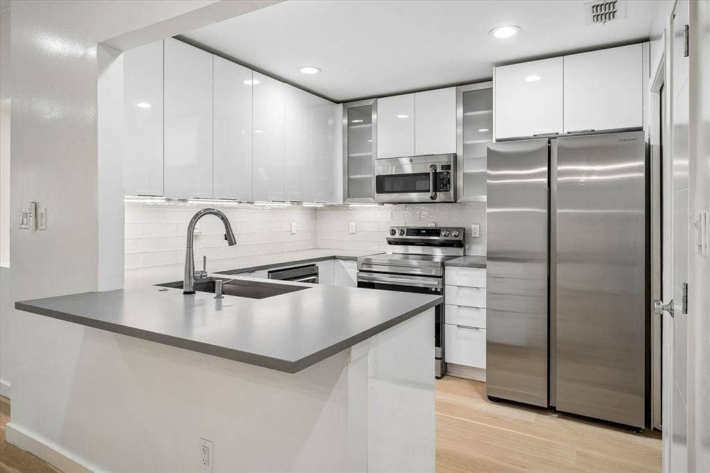 12680 Hillcrest Road, #1109, Dallas, TX 75230 Completely updated kitchen with Kitchen Kraft acrylic cabinets. Refrigerator conveys with the property.