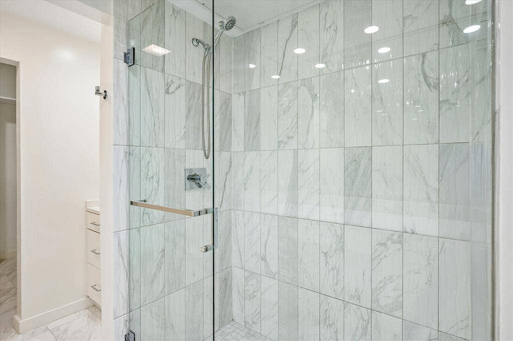 12680 Hillcrest Road, #1109, Dallas, TX 75230 Elegant oversized shower in primary bathroom.