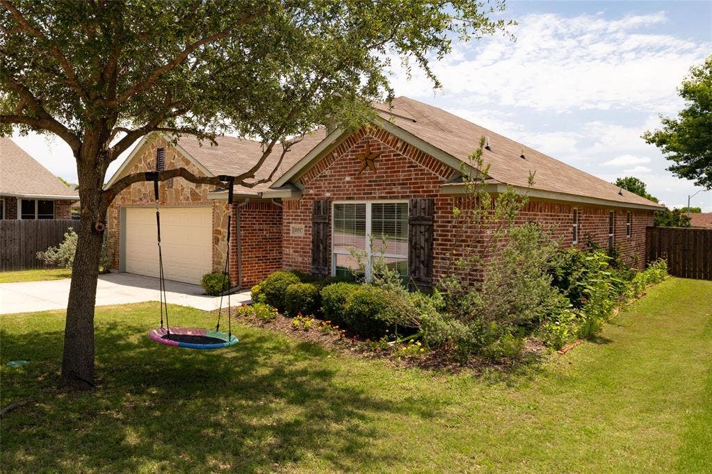 10517 N Haven Drive, Benbrook, TX 76126 Side of home with gate has wonerful landscaping down the side.
