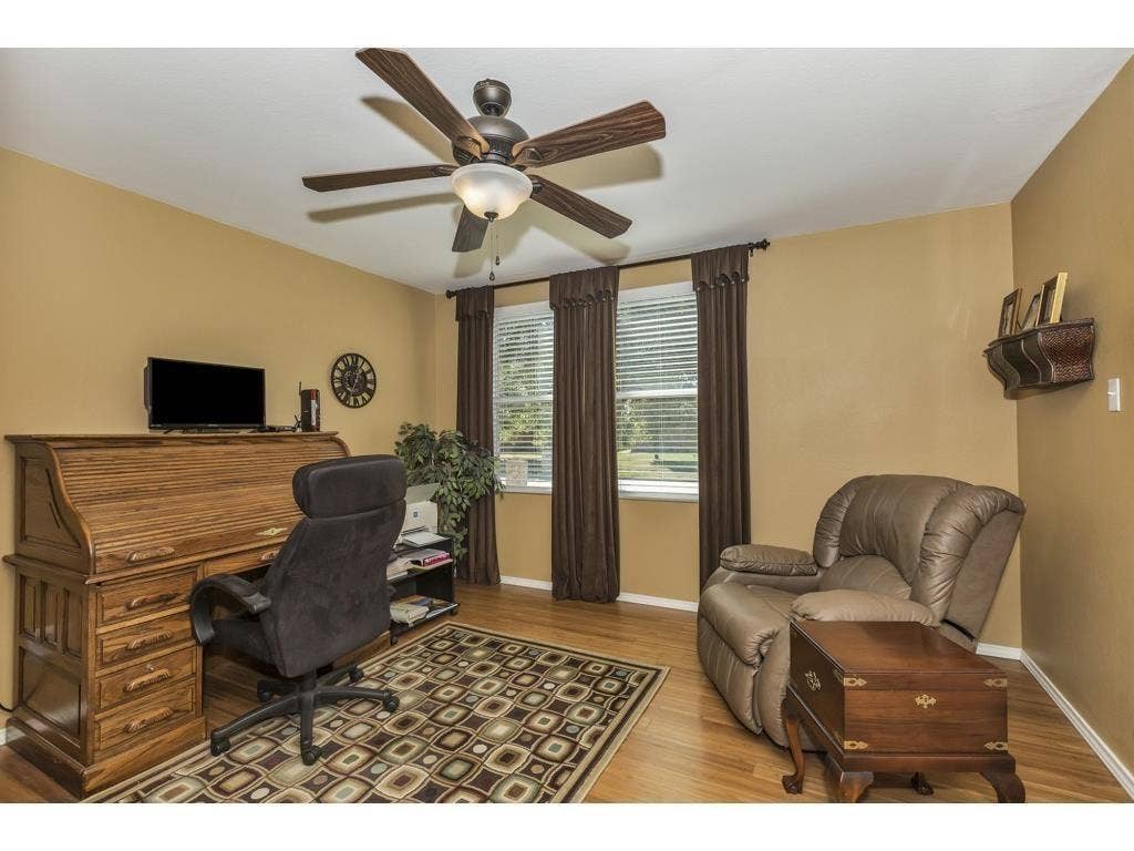 2912 Lake Terrace Drive, Wylie, TX 75098 Interior room featuring wood-finish flooring and a ceiling fan with integrated lighting