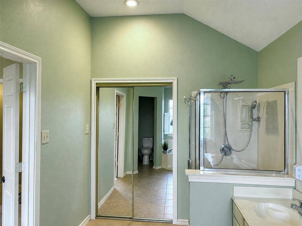 1221 Big Bend Drive, McKinney, TX 75069 Master bath is an ideal situation featuring two vanities, a separate, soaking tub, shower, a water closet for the toilet and a respectable sized walk-in closet.