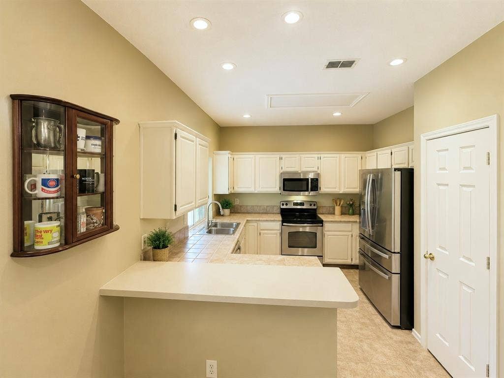 1221 Big Bend Drive, McKinney, TX 75069 Kitchen features a serving bar to the den and breakfast room and large enough for the family to gather around in the morning for breakfast!