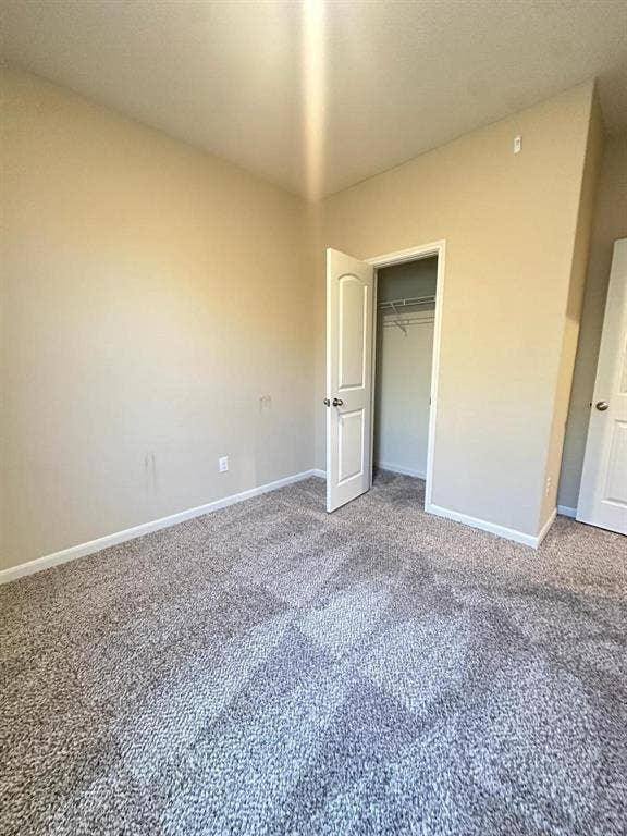 1707 Cotton Blossom Lane, Princeton, TX 75407 Neutral-toned walls complement the gray carpeting
