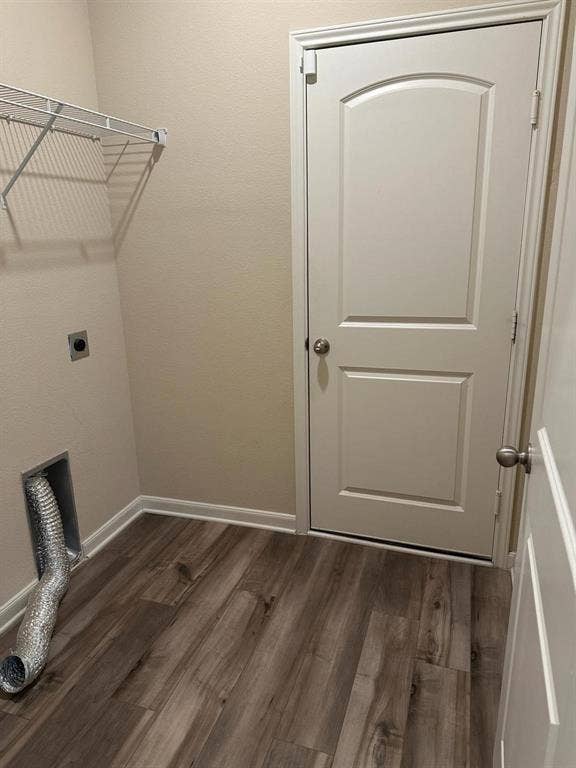 1707 Cotton Blossom Lane, Princeton, TX 75407 Utility space featuring wood-finish flooring, light tan walls, and white trim