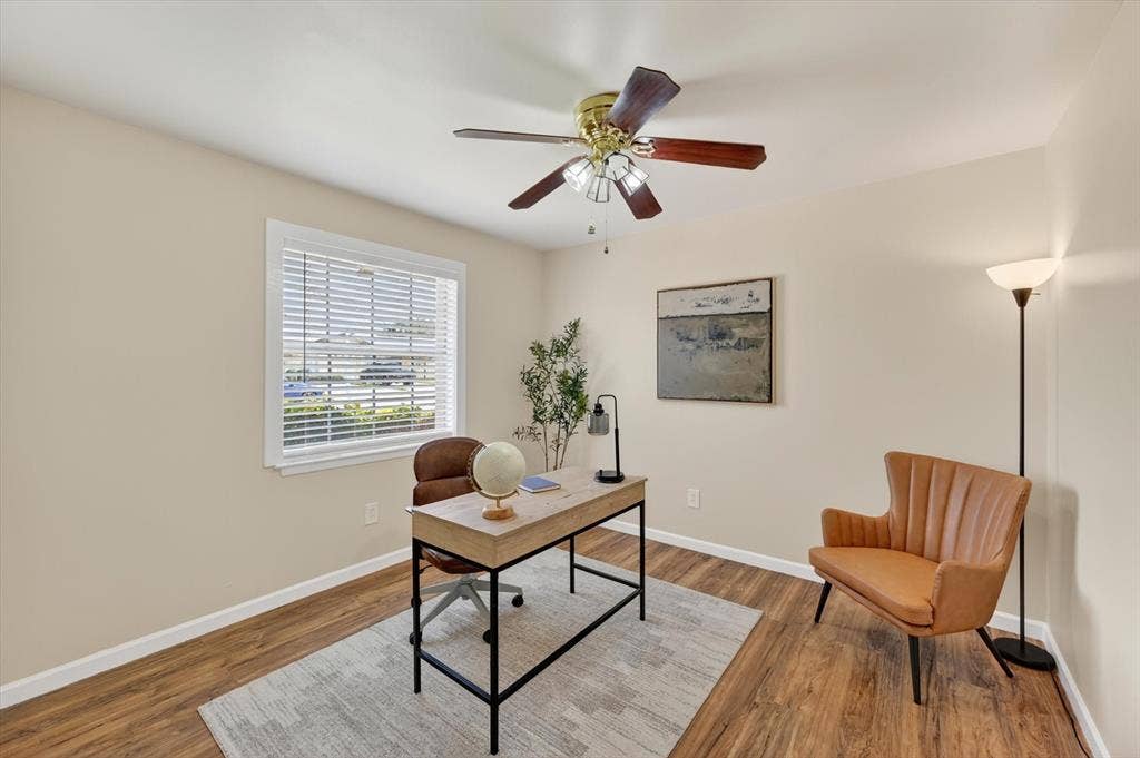 1012 Plover Lane, Arlington, TX 76015 Room with wood-finish flooring, a ceiling fan with integrated lighting, and a window with blinds