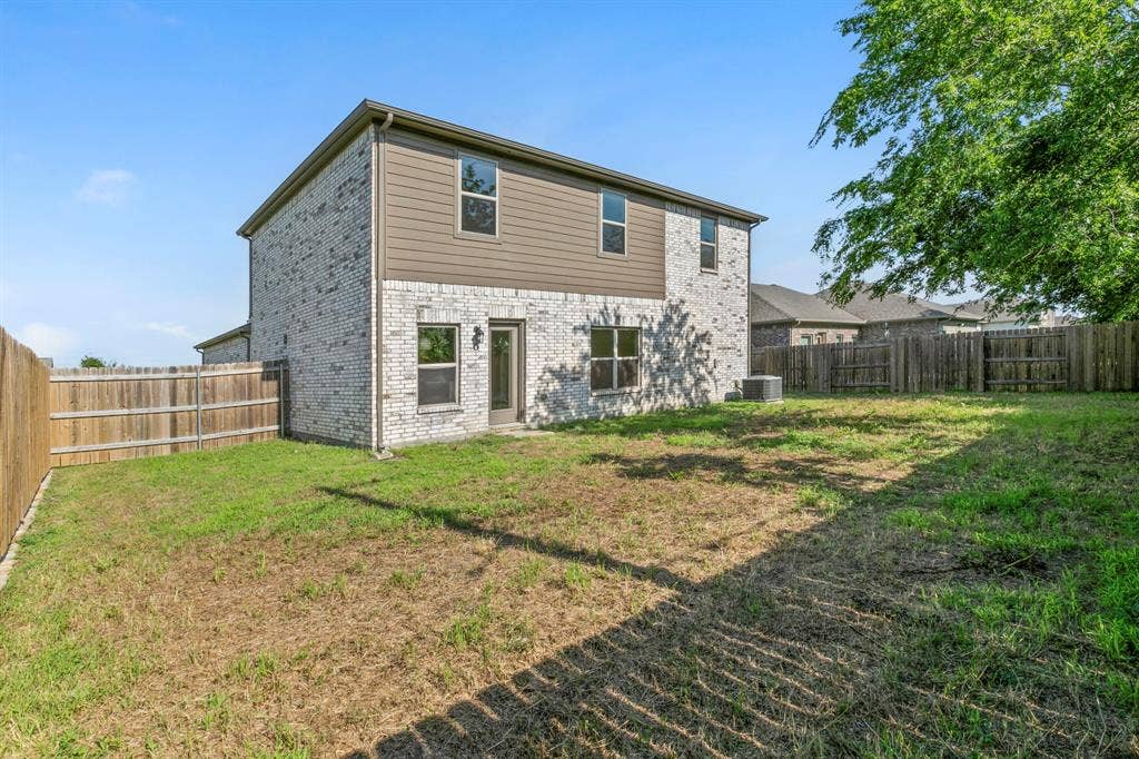 1516 Kinglet Street, DeSoto, TX 75115 Two-story exterior featuring light brick and horizontal siding