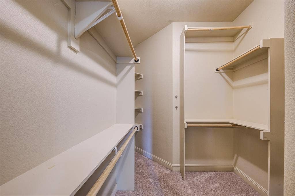 245 Fm 407 W, Argyle, TX 76226 Walk in closet featuring carpet floors and shelving