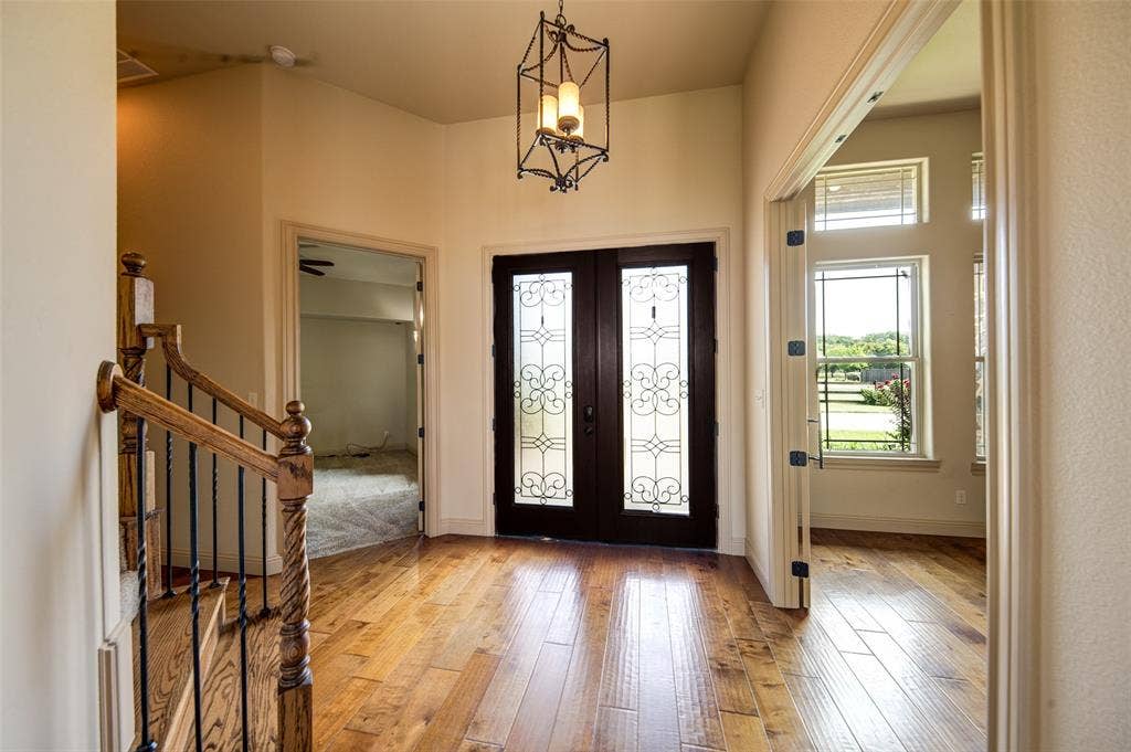 245 Fm 407 W, Argyle, TX 76226 Entryway featuring french doors, light wood-type flooring, and stairs