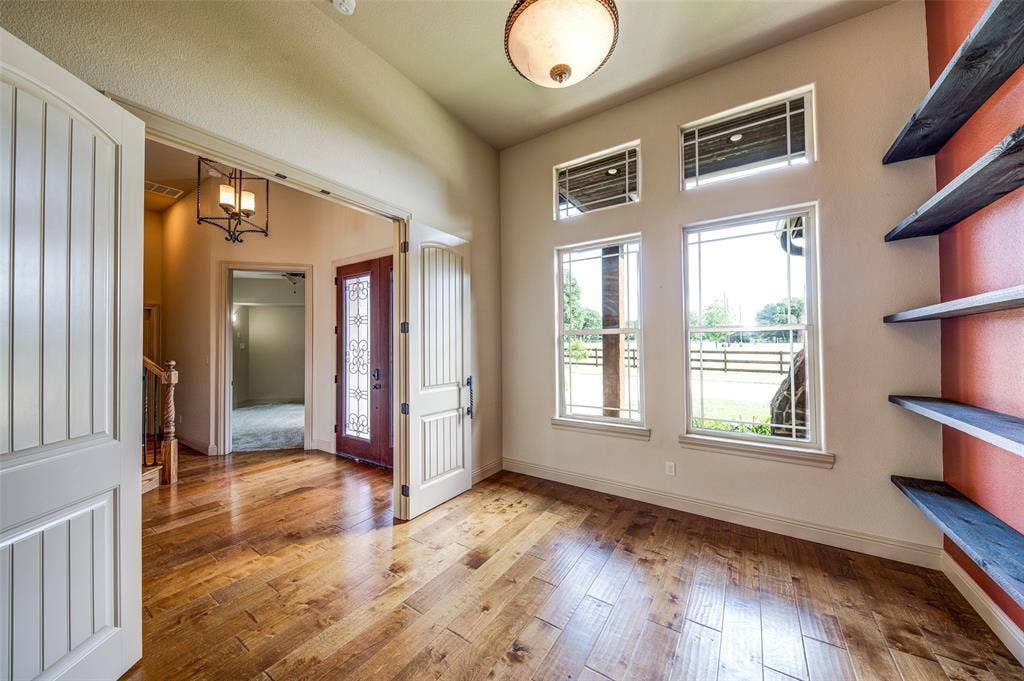 245 Fm 407 W, Argyle, TX 76226 Office entrance with wood-type flooring and a chandelier