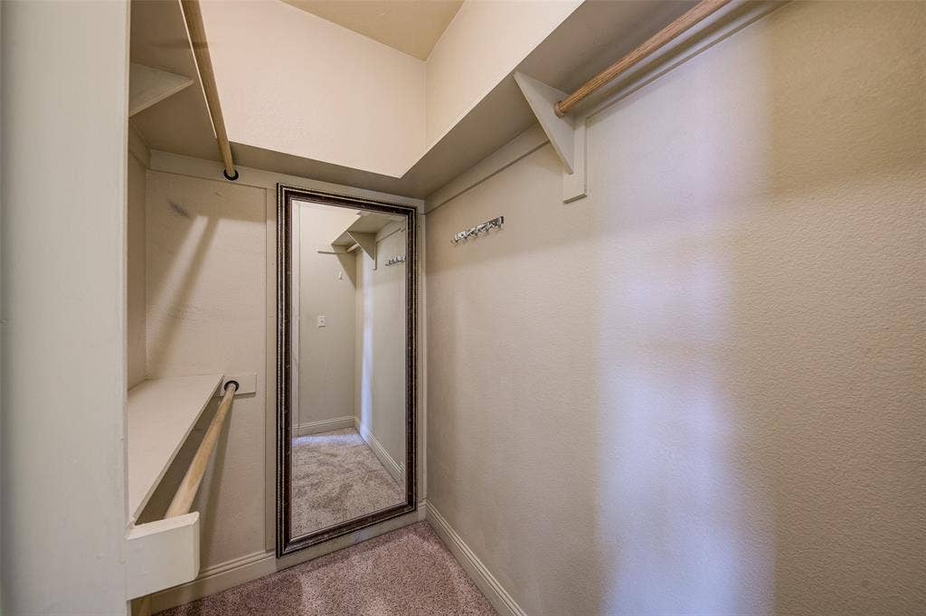 245 Fm 407 W, Argyle, TX 76226 Walk in closet with carpet floors and hidden door to secret room