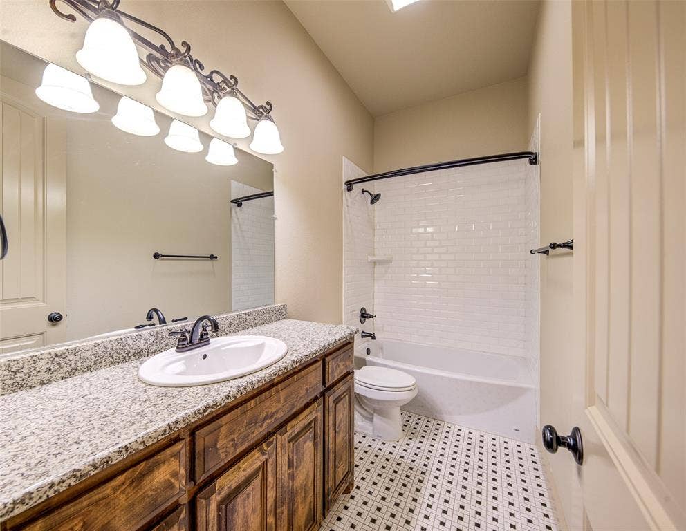 245 Fm 407 W, Argyle, TX 76226 Full bathroom featuring granite vanity and bathtub / shower combination