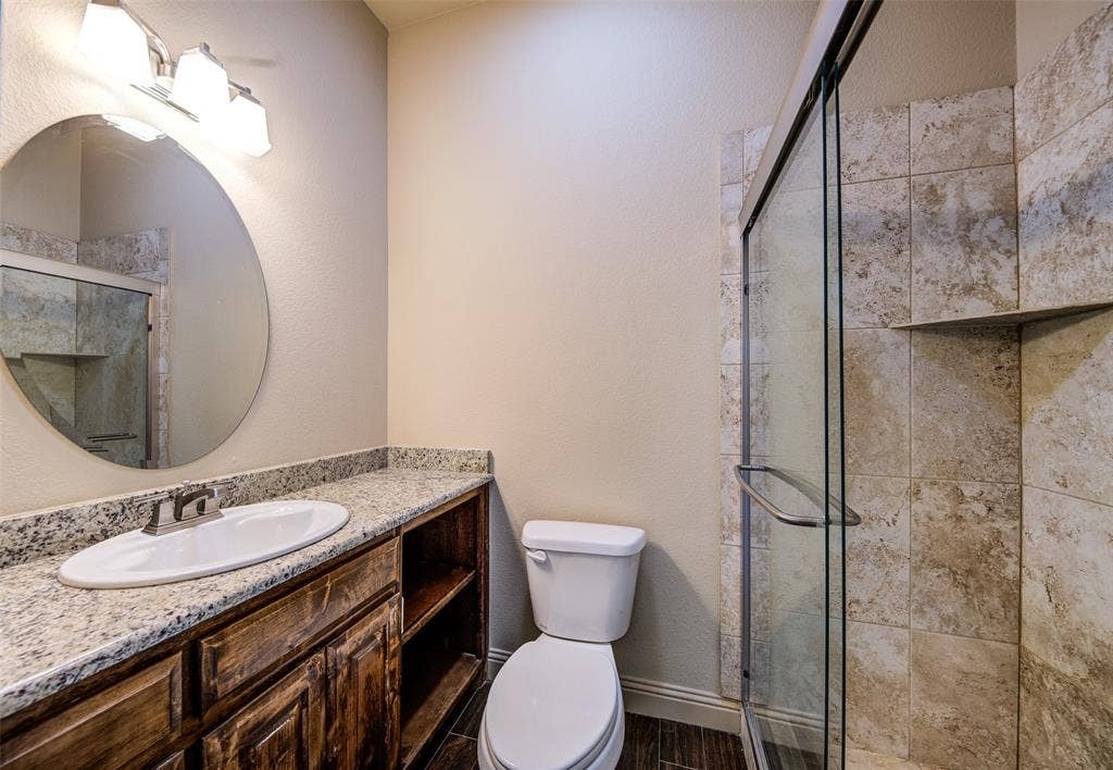 245 Fm 407 W, Argyle, TX 76226 Full bathroom featuring granite vanity and a stall shower