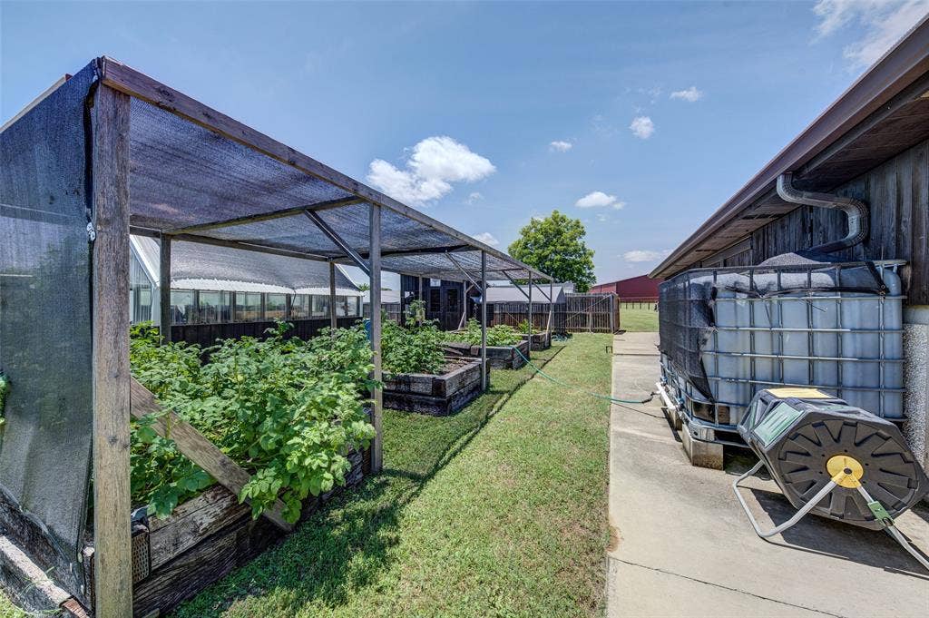 245 Fm 407 W, Argyle, TX 76226 View of yard featuring a vegetable garden and a greenhouse