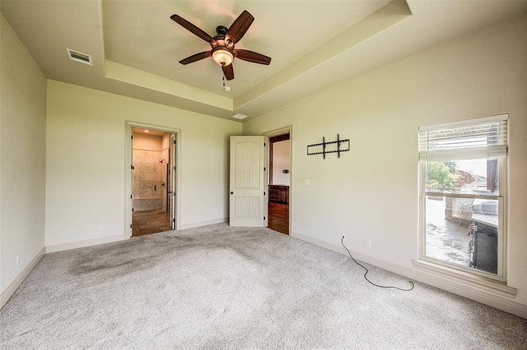 245 Fm 407 W, Argyle, TX 76226 Unfurnished bedroom with new carpet, a tray ceiling, and ensuite bathroom