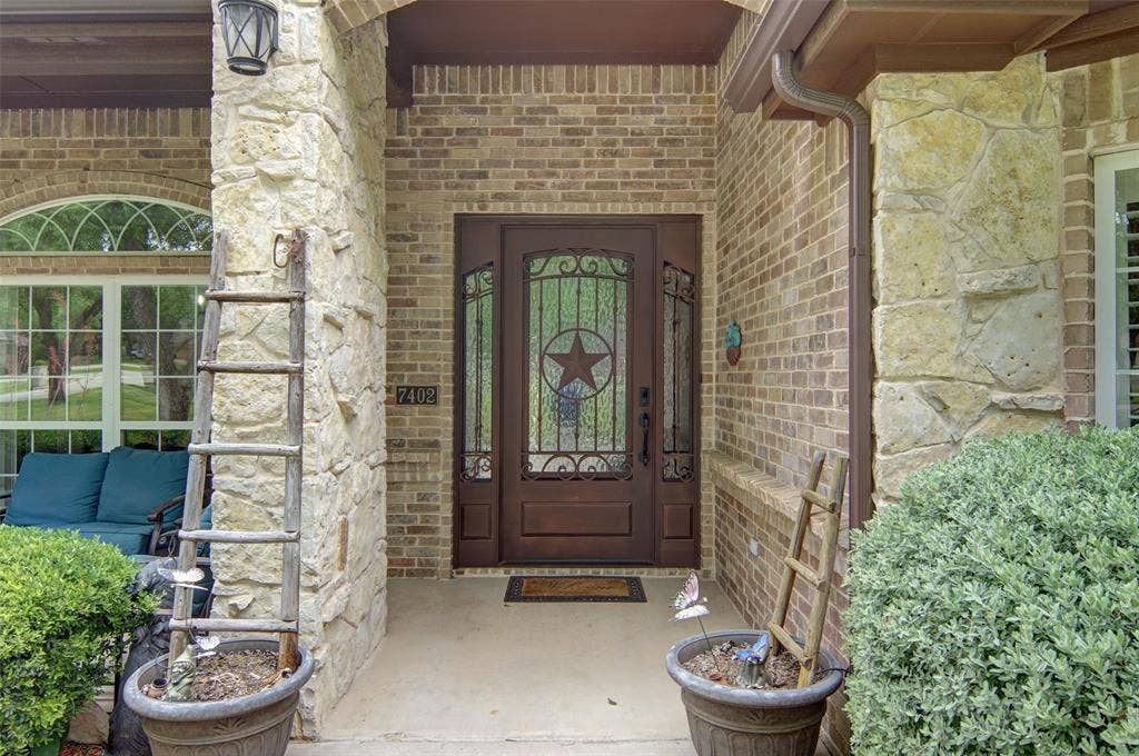 Beautiful entry with covered porch.