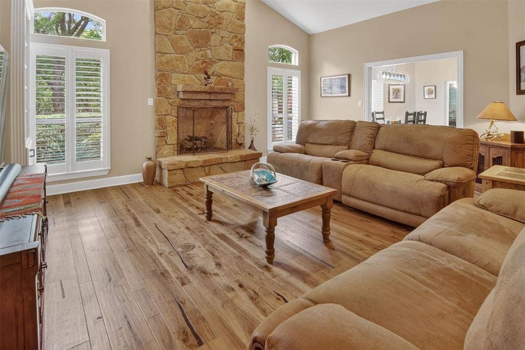Spacious family room with beautiful stone fireplace.